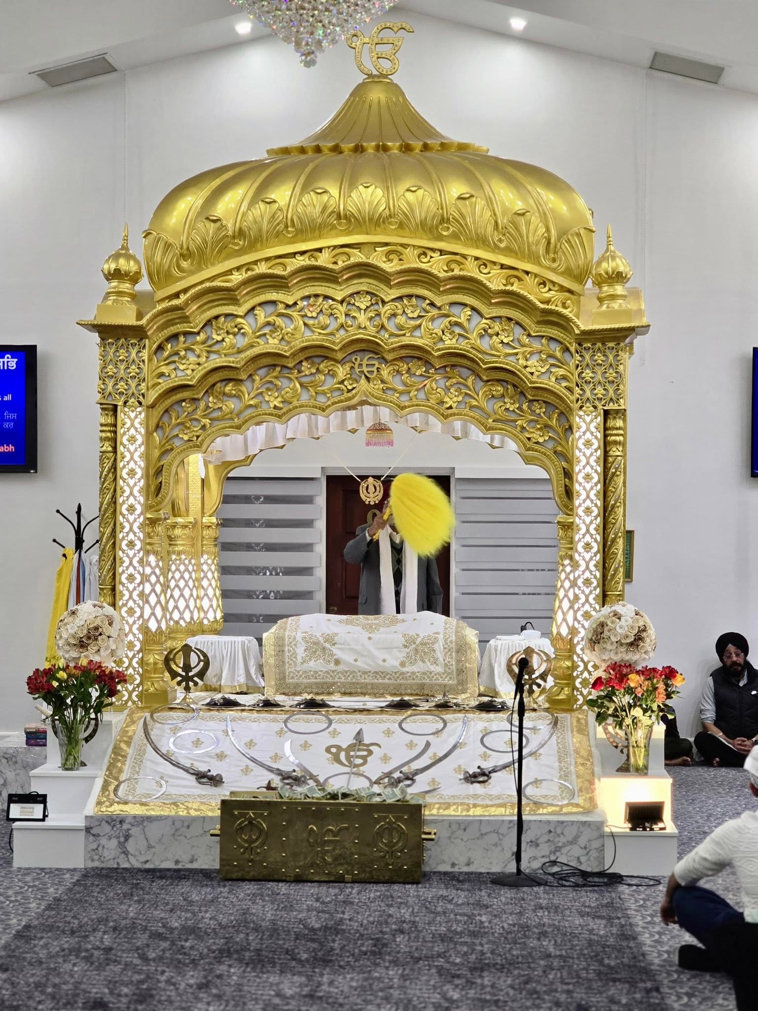 Kirtan during a diwan with the golden Palki Sahib