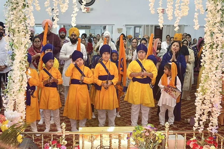 Children dressed as the Panj Pyare leading a Nagar Kirtan procession